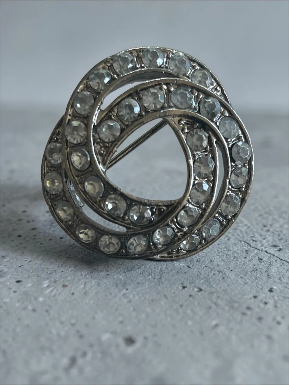 Luminous Ice Blue Crystal Gunmetal Knot Brooch Pin